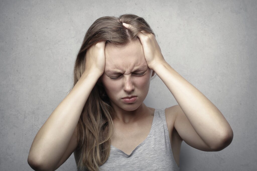 woman suffering from neck pain